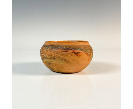 A round terracotta vase with black, green and red painted veins. Badlands Pottery ink stamp. Dimensions: 4.75"W x 2.5"HManufa