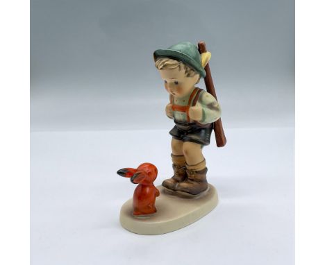 Beautifully hand painted porcelain of an adorable young boy carrying a rifle timidly hunting who comes face to face with a ra