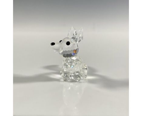 A clear faceted figure of a sitting fox with a frosted tail and black eyes and nose. Swarovski marking. This item has its ori