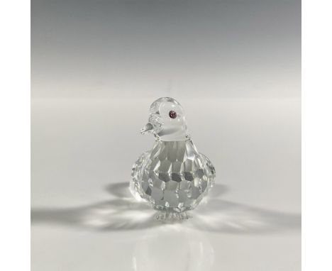 A clear faceted figure of a bird with large feathers on the back and pink gemstone eyes. Part of the Feathered Friends collec