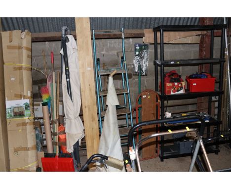 A wooden and metal step ladder and a roll of trim proof material