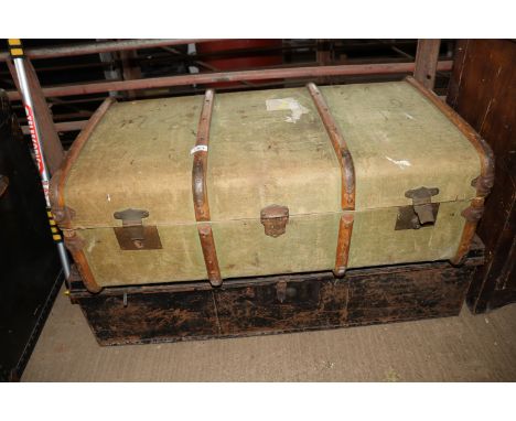 A metal trunk and a vintage wooden bound trunk 