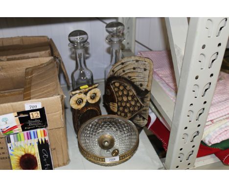 Two decorated glass decanters, a fish ornament, and owl ornament and a light shade