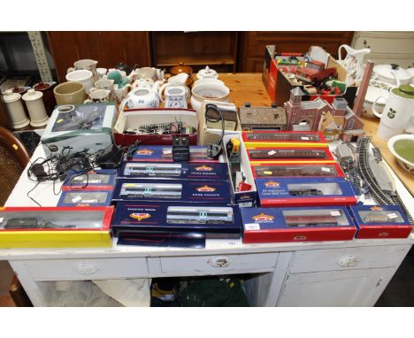 A collection of various Bachmann, Hornby and other model railway items including rolling stock, track, buildings etc. togethe