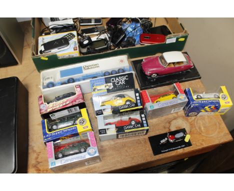 A quantity of boxed model vehicles etc.