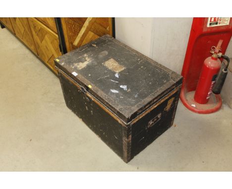 A metal bound trunk by H J Cave & Sons, Wigmore Street, London