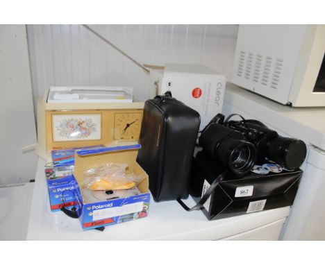 A Swann teasmaid, a wireless AV sender,  a pair of Tasco 16 x 50 binoculars, three Polaroid cameras etc.