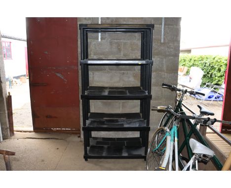 Two plastic shelf units 