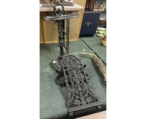 Cast iron stick stand together with another 