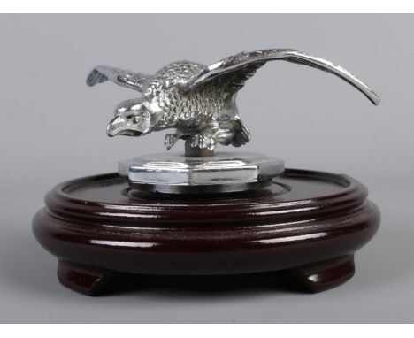 A 1930s Desmo car mascot modelled as an eagle. Raised on hardwood base.