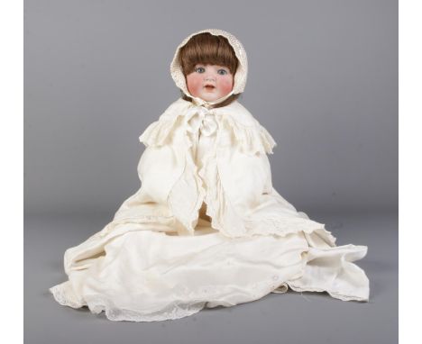A Simon &amp; Halbig/Kamer &amp; Reinhardt bisque head doll, No. 126. Dressed in period clothes.