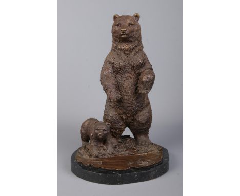 A bronze sculpture modelled as a standing bear with bear cub, on marble base. Signed Mene. Height 31cm.