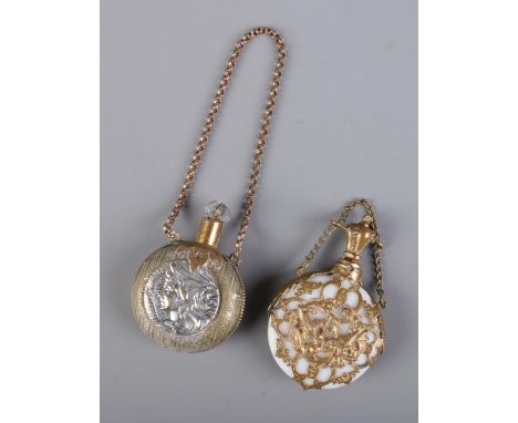Two antique gilt metal and glass chatelaine scent bottles on chains to include example featuring portrait of a maiden and the