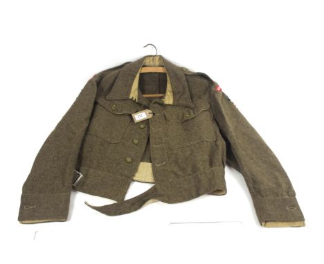 A good WWII 1940 Patt battledress blouse dated 1944 with Royal Norfolk Regiment insignia and dive patches 