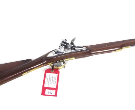 A .75" bore "Flintlock" action shot gun N.V.N. in overall good condition. A working replica of a Brown Bess style carbine.Thi