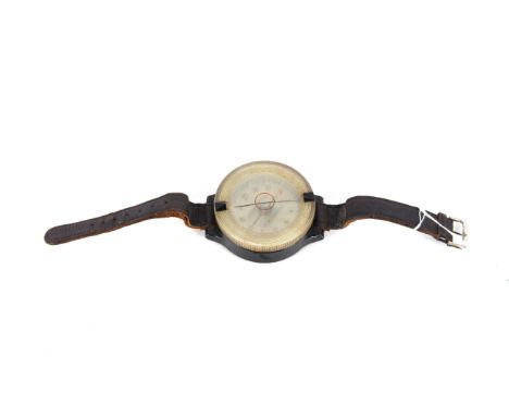 A Luftwaffe wrist compass, a used example with replacement strap