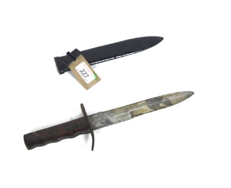 A WWII Italian M.V.S.N. enlisted mans dagger. This example has had the wooden grip personalised with carvings, original scabb