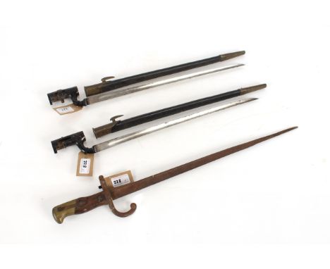 Two British model 1876 socket bayonets, both have scabbards and sockets painted black, also one with locking ring missing; to