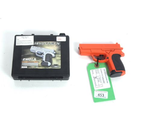 A small air soft (metal construction) but "Orange" pistol within case.As a post 1939 air weapon the restrictions of the crime