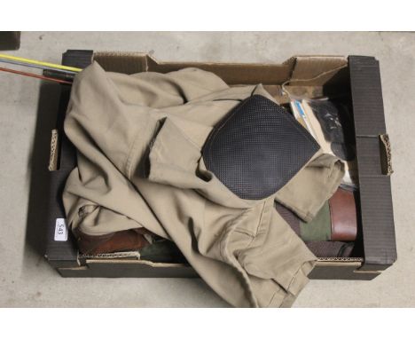 A mixed lot including cleaning items, gun slips, and a shooting jacket etc.