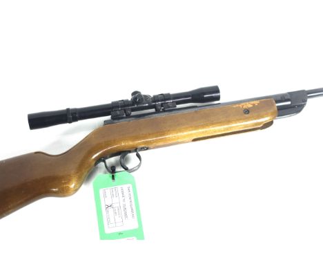 An original Model 25 .177 Cal. air rile , iron sight replaced with an original Model 7 4x20 scope.As a post 1939 air weapon t