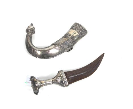 An Omani Jambiya dress dagger with white metal covered scabbard and grip (NB blade with surface rust)