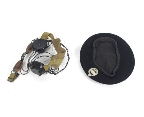 A black beret with Tank regiment badge and a pair of headphones etc. 