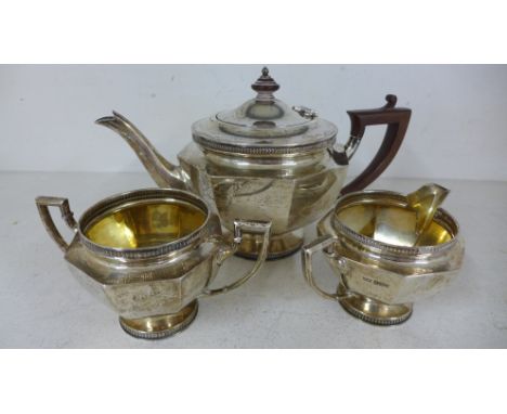 A silver hallmarked three piece tea service consisting of teapot, milk jug and sugar bowl marked for Mappin & Webb Sheffield 
