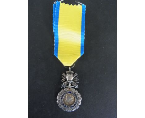 A Republic of France medal for "Valeur et Discipline" - Diameter 25mm - with ribbon but some enamel loss possibly World War I