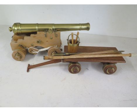 A model of a 12 PDR ships gun calibre 4.623 inch circa 1780 with plan on wooden base with wooden wheels, Trailer and tools - 