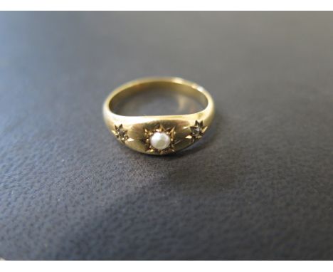 A small 18ct yellow gold pearl and diamond ring size J - approx weight 2.5 grams - wear to top of pearl