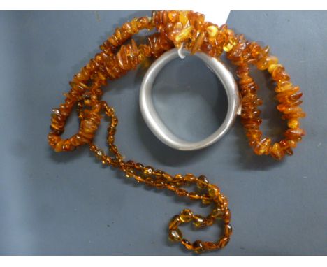 Two amber necklaces and a heavy .925 silver bangle - Weight approx.2 troy oz  - necklaces 54 and 68cm long