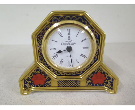 Royal Crown Derby - Old Imari pattern mantel clock, Roman numerals to white enamel dialCondition report: Good condition, work