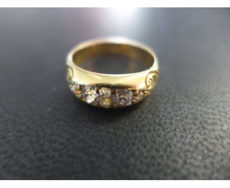 An 18ct yellow gold six stone diamond ring size K - approx weight 5.4 grams - signs of re sizing, some general usage wear