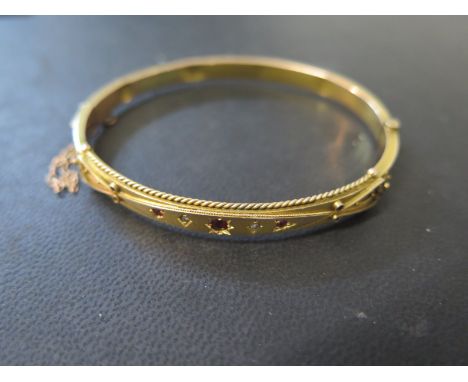 A 9ct diamond and ruby bracelet approx weight 8 grams - some denting but clean condition