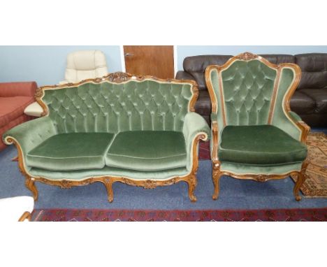 FRENCH STYLE FLORAL AND ROCOCO CARVED BEECH WOOD FRAMED LOUNGE SUITE OF TWO PIECES, BUTTON UPHOLSTERED IN GREEN VELVET COMPRI