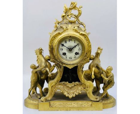 A Louis XVI revival French gilt spelter mantel clock, 8cm porcelain dial with Arabic numerals over twin wind up holes, the ba