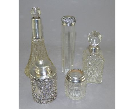 An Edwardian silver&nbsp; tea caddy, Birmingham 1906, a facetted glass toilet jar and cover, London 1903, another London 1910