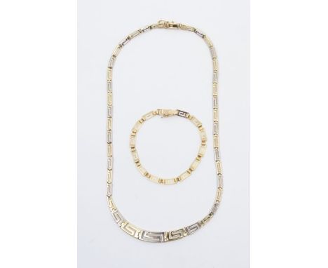 A 14k white and yellow gold necklace of stylised graduated pierced links with similar 14k gold bracelet with 'Lindos Gold' gr