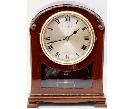 A 20th century French mahogany Bulle clock, dome form with a carved laurel wreath to the top over a circular brass glazed doo