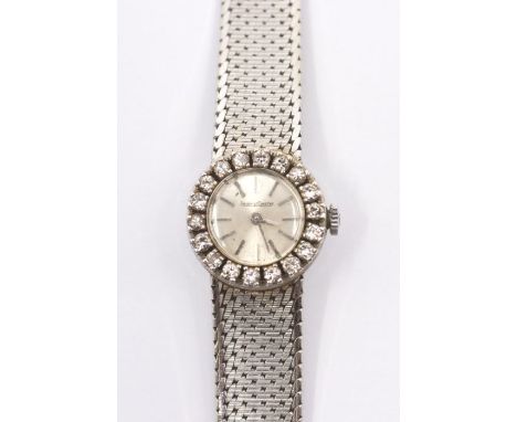 An 18ct white gold Jaeger LeCoultre lady's watch with diamond set bezel,&nbsp;baton numerals, gross weight 34.7g, in box.