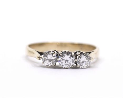 A 9ct three stone diamond ring, total diamond weight approx 0.45ct, 2.1g
