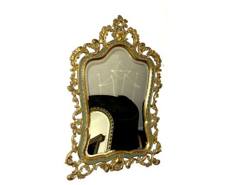 A Rococo revival gilt mirror, in a cartouche shape form, foliage carved decoration and later painted, 20th Century. 98cm H x 
