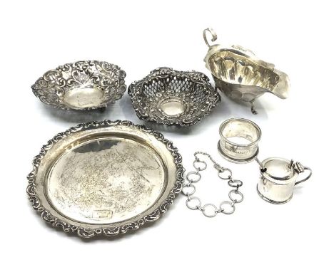 A .925 marked chain bracelet, a lobed oval cream jug, silver napkin ring, a silver cylindrical mustard pot and spoon, a small