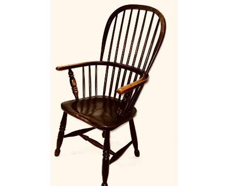 A 19th elm and beech stick back Windsor chair with saddle seat on turned legs joined by "H" stretchers