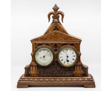 A 20th Century carved oak&nbsp;Clock/barometer desk compendium marked by Birch, Leicester, carved in a manner of a chapel, tw