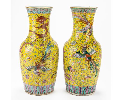 A PAIR OF CHINESE BALUSTER YELLOW-GROUND FAMILLE-ROSE `DRAGON AND PHOENIX' VASESBlue six character Guangxu mark and of the pe
