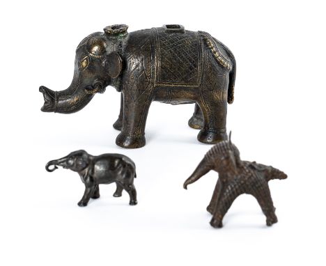 THREE INDIAN BRONZE ELEPHANTS (3)19th/20th century The largest with various apertures and probably part of a lamp, sizes 6cm 