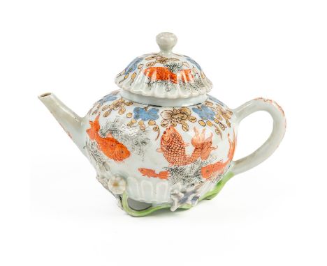 A CHINESE EXPORT `CHRYSANTHEMUM' MOULDED TEAPOT AND COVER (2)Late Yongzheng/early Qianlong The compressed globular body paint
