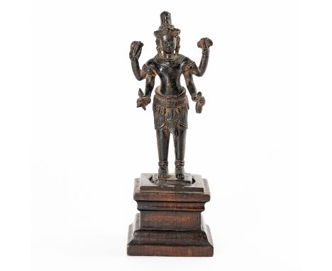 A KHMER BRONZE FIGURE OF PADMAPANIAngkor Wat style, 12th/13th century The four-armed Buddhist deity holding various attribute